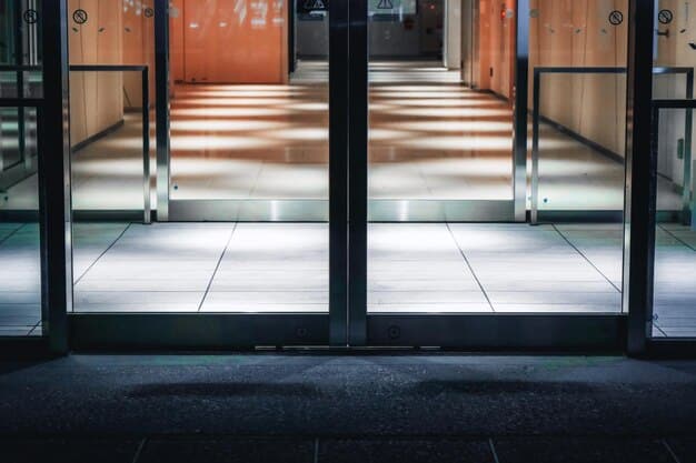 A close-up shot of an ADA-compliant entrance ramp leading to a store's front doors. The ramp should have a gentle slope, handrails on both sides, and a textured surface for improved traction. Include clear signage indicating the accessible entrance.