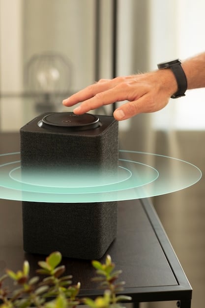 A close-up of a person speaking into a smart speaker, with a holographic display showing product search results and voice command prompts, emphasizing the importance of voice search optimization for voice commerce.