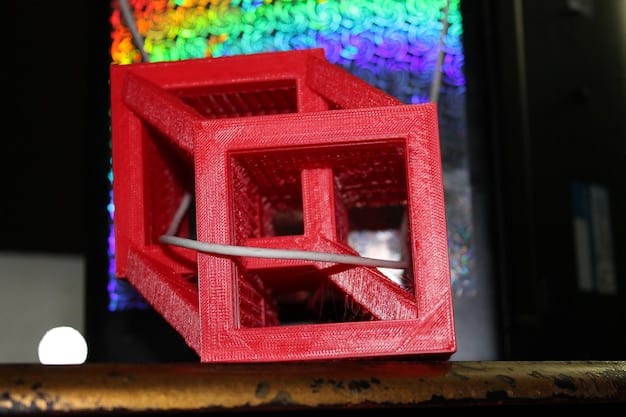 A close-up shot of a 3D printer creating a complex geometric design out of vibrant blue plastic filament. The printing head is precisely layering the material, showing how 3D printing enables flexibility.