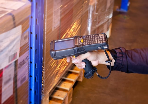 A detailed photo of a barcode scanner in operation within a 3PL warehouse. The scanner is accurately capturing data from a product label, with a focus on the technology and precision involved in inventory management. The setting illustrates an environment driven by automation and technological integration, vital for optimizing retail supply chains in the US.